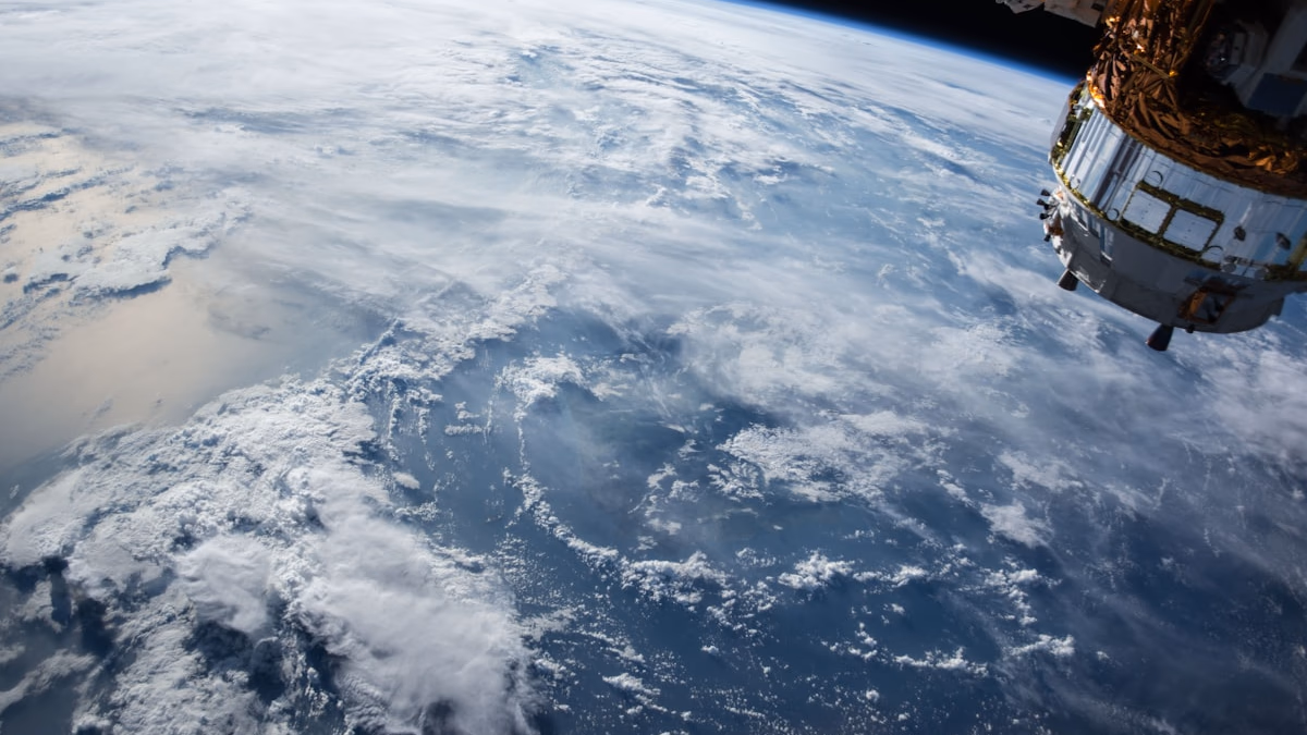 A satellite orbiting Earth, representing the next frontier of orbital AI and space-based data centers.