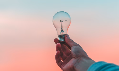 A content creator's workspace with a laptop, camera, and a physical privacy shield on the webcam, symbolizing digital sovereignty.