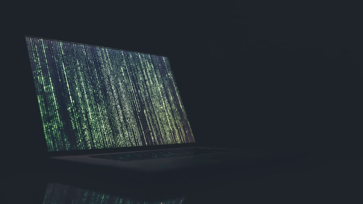 Dark cybersecurity background with code representing the ShinyHunters data breach of Rockstar Games via Anodot and Snowflake in April 2026