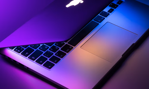 MacBook Pro laptop on a desk representing the upcoming Apple M6 chip MacBook Pro redesign expected in late 2026