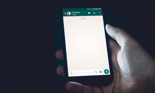 Smartphone showing WhatsApp chat interface representing the new WhatsApp username feature rolling out in April 2026 to hide phone numbers