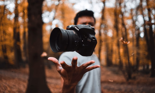 A collection of photographs being organized by a digital interface, representing private and intelligent photo management.