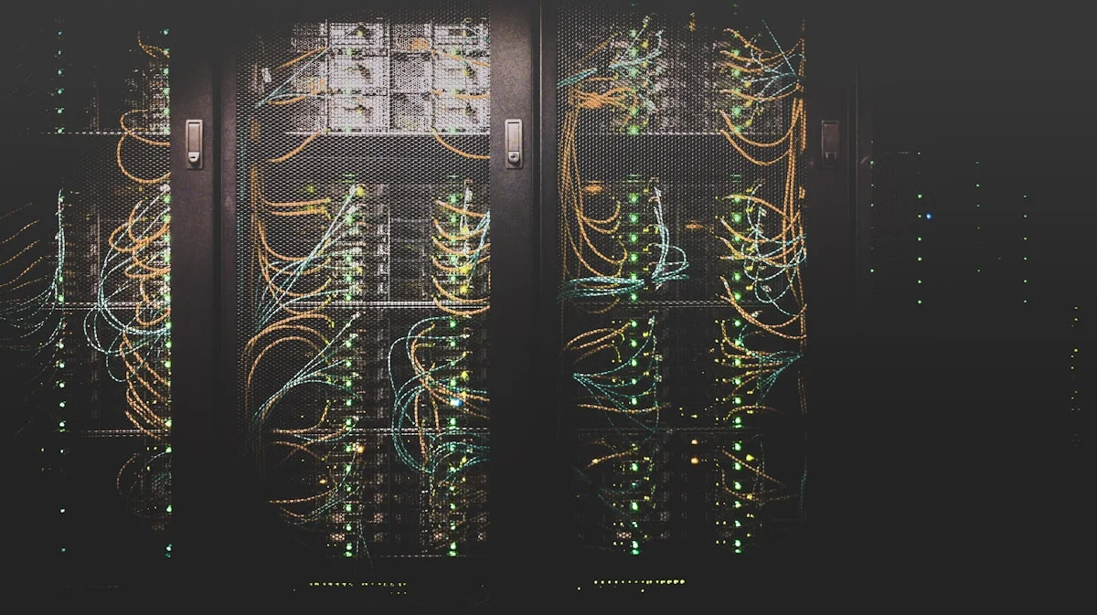Server rack with glowing blue LED lights in a dark enterprise data center, representing self-hosted AI infrastructure and data sovereignty for organizations using open-source tools like Mozilla Thunderbolt.