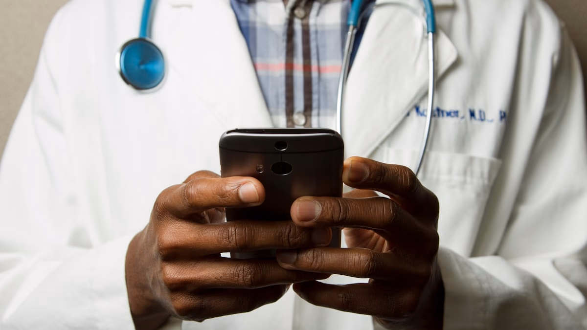 A person's hand holding a smartphone displaying a health-related AI interface, with a stethoscope in the background, representing the intersection of digital wellness and medical technology.