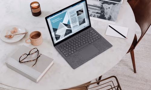 A close-up of hands typing on a laptop keyboard in a dimly lit office, with a faint transparent overlay of data streams and tracking indicators — representing Meta's Model Capability Initiative, which captures employee keystrokes, mouse movements, and screenshots across hundreds of work apps to train AI agents intended to perform white-collar tasks autonomously.