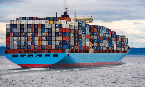 Terminal showing docker compose up -d output with four containers starting — web, api, postgres, redis — and docker compose ps showing all containers healthy with port mappings on Ubuntu 24.04.