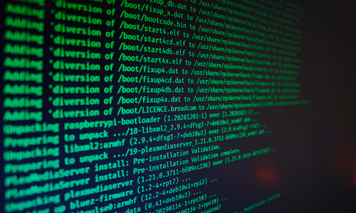 A laptop screen displaying the Linux terminal with a privacy-focused distribution logo, representing the switch to an open-source, sovereign operating system.