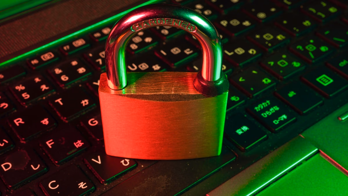 A digital padlock and key representing the comparison between Bitwarden and 1Password password managers in 2026