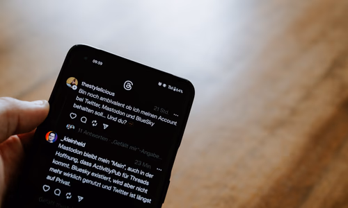 A person looking at a phone screen with a sycophantic AI response, representing the Stanford study on AI flattery and its harmful effects on users in 2026