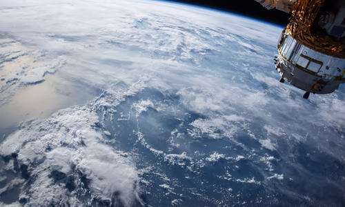 A satellite orbiting Earth, representing the next frontier of orbital AI and space-based data centers.