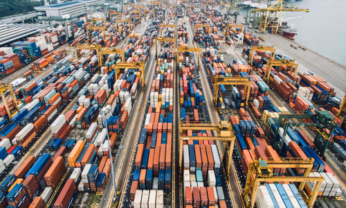 A highly automated factory floor with robotic arms and AI-driven control systems, representing China's 2030 manufacturing vision.