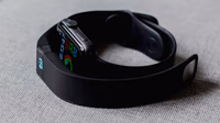 Smartwatch and smartphone showing wellness data while a Google Health interface overlays the screen, representing Fitbit rebrand