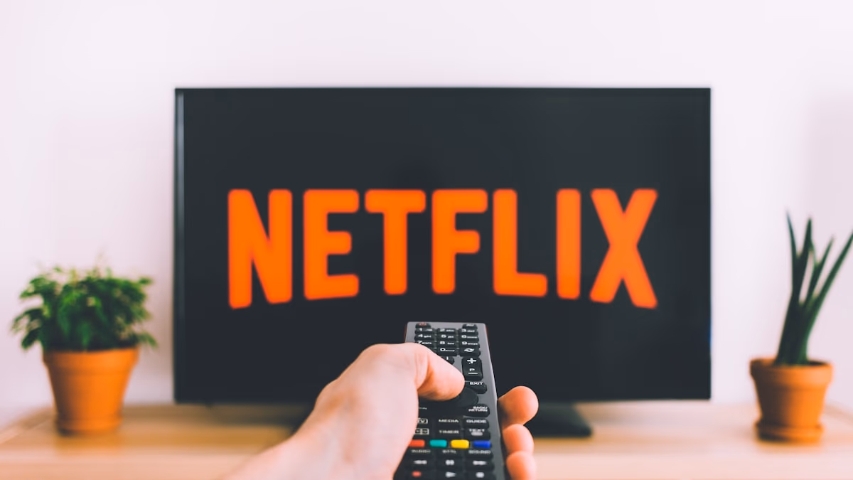A person lying in bed at night, face illuminated by the glow of a smartphone screen showing a vertical video feed, representing late-night doom-scrolling and the attention harvesting economy of streaming platforms in 2026.