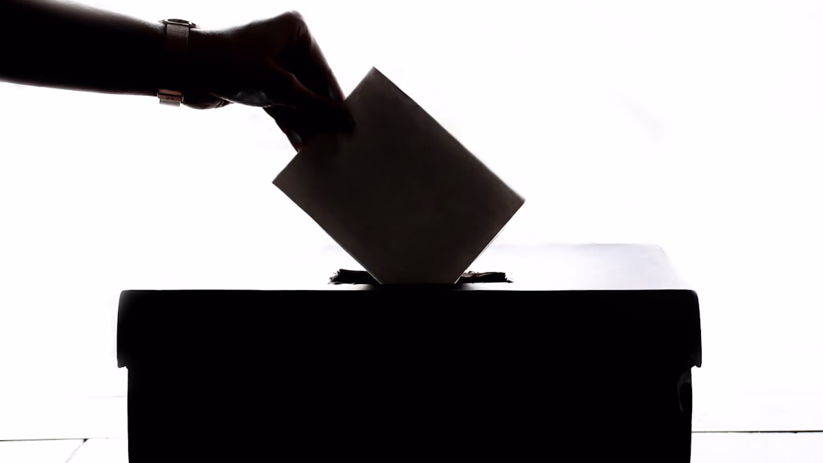 A close-up of electronic voting machine controls, representing election security and digital sovereignty.