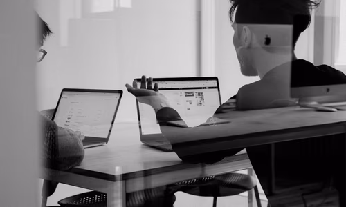 A clean, modern home office setup with multiple monitors and a secure laptop, representing a private workspace.