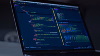 Developer at a laptop with layered holographic code and AI visualizations
