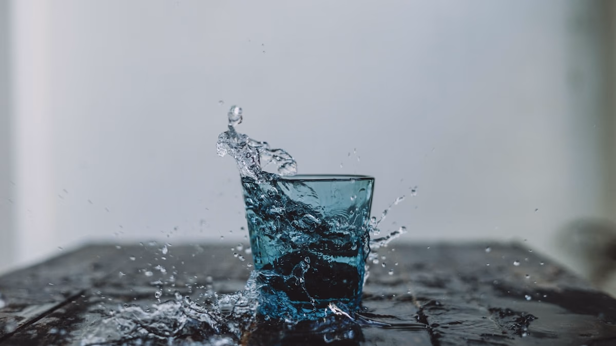 A clean, minimalist glass of water on a dark background, representing the purity and privacy of Aura Water's design.