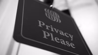 A glowing digital cyber security shield representing AI governance and data privacy controls.