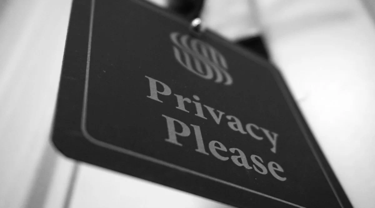 A glowing digital cyber security shield representing AI governance and data privacy controls.