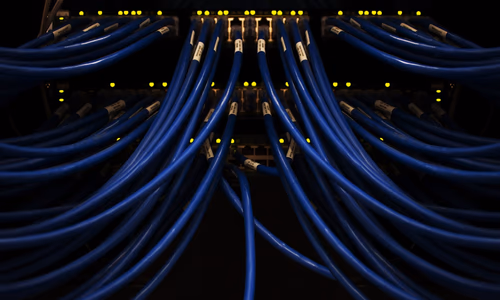 A network-wide ad blocker represented as a digital shield for all devices.